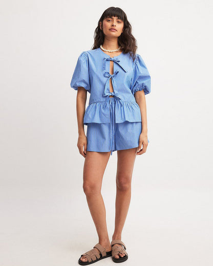 coord sets,bottomwear, topwear,casual, vacation,bold, glam, genz fit, soft girl,woven,polycotton,printed,blue,pinstripes, stripes,gathered, pinstripes, tie knot,drawstring,regular fit top,tie up top,waist length top,flared hem,round neck,puff sleeves,elbow length sleeves,shorts,mini shorts,mini,straight hem,mid rise waist,25060047GG, OY2015
