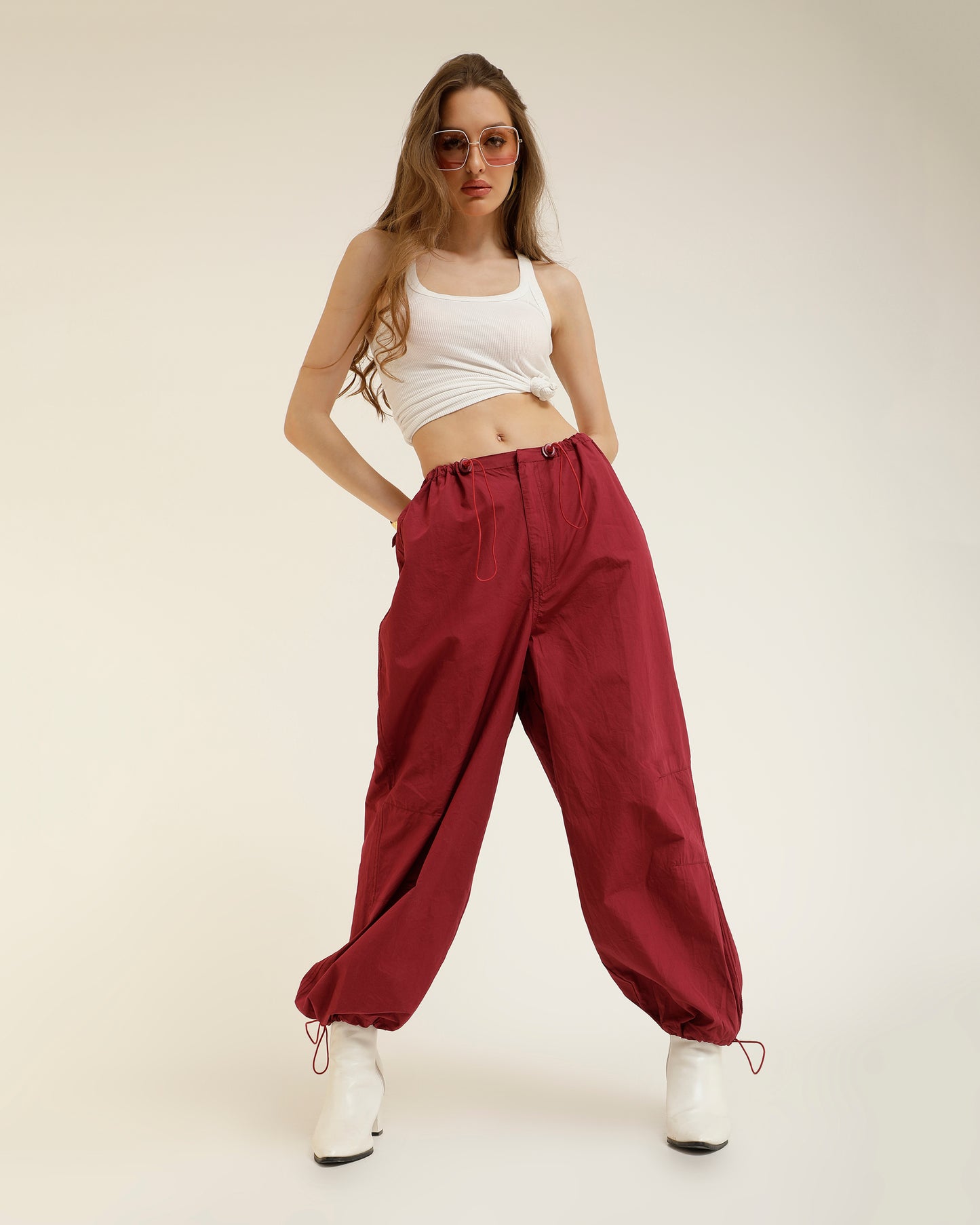 ADJUSTABLE SLIDER PARACHUTE PANTS,adjustable strap, adjustable waist, bottomwear, cotton, drawstring, full length, high rise, high waist, maroon, new drop april 24, pants, parachutes, trousers,parachute-adjustable-slider-trouser,Length - Full length Waist - High-rise waist Fit - Regular fit Color - MaroonNo. of Pockets - 2Material - Cotton Length - 40"Closure - Zip &amp; hook Detail - Adjustable sliders