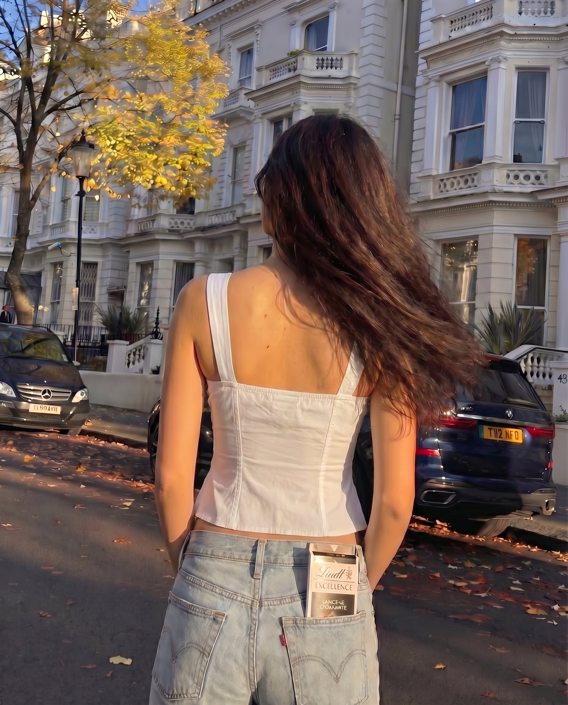 pinktuck-detail-slit-top-white,topwear,tops,casual,streetwear,woven,Stretchable,poplin,white,solid,ruched,regular fit,slit,regular,slit,square neck,shoulder strap,sleeveless,Color: White
Fabric: Poplin
Fit: Skinny Fit 
Length: Regular
Neck: Square Neck
Closure: Hook & Eye
Print: Solid
Details: Pintuck seam detailing adds texture and structure. The contrast bow tie at the center adds a feminine touch.,PINKTUCK DETAIL SLIT TOP