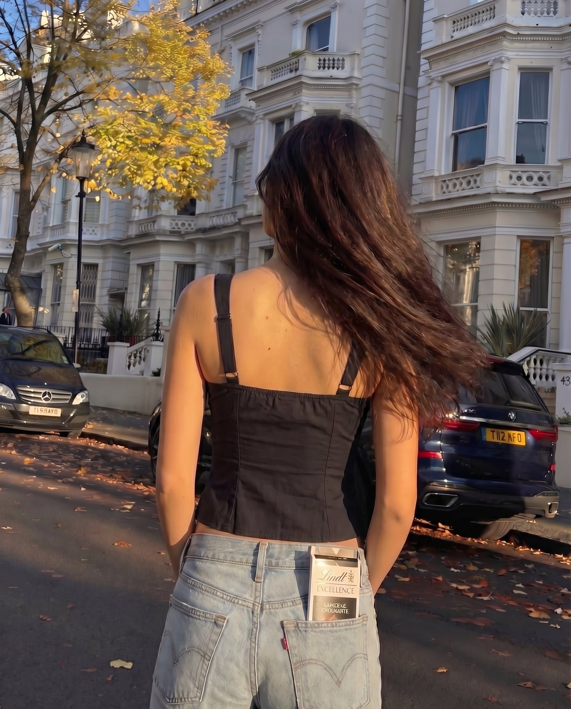 pinktuck-detail-slit-top-black,topwear,tops,casual,streetwear,woven,Stretchable,poplin,black,solid,ruched,regular fit,slit,regular,slit,square neck,shoulder strap,sleeveless,Color: Black
Fabric: Poplin
Fit: Skinny Fit 
Length: Regular
Neck: Square Neck
Closure: Hook & Eye
Print: Solid
Details: Pintuck seam detailing adds texture and structure. The contrast bow tie at the center adds a feminine touch.,PINKTUCK DETAIL SLIT TOP
