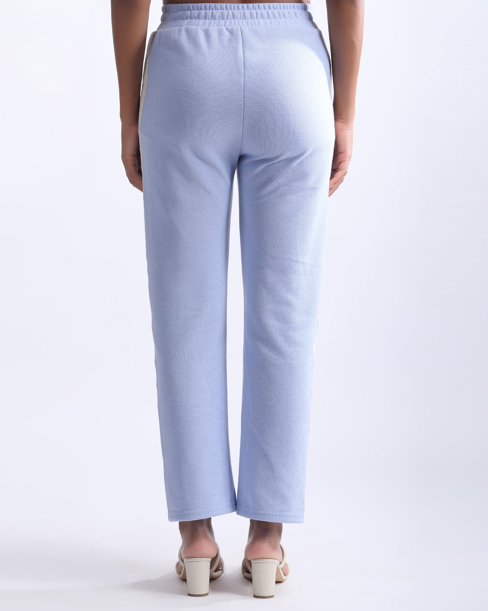 HIGH RISE LOUNGE TROUSER,blue, bottomwear, full length, high rise, knitted, lace, loungewear, relaxed fit, ribbed, trousers, wide leg,high-rise-lounge-trouser-blue,Color- Blue  
Fit- Straight Fit 
Length- Full 
Waist- High Rise 
Closure- Elasticated 
No. of Pockets- 2 
Fabric- Ribbed  
Print/ Pattern- Solid 
Details/Design Elements- Laced