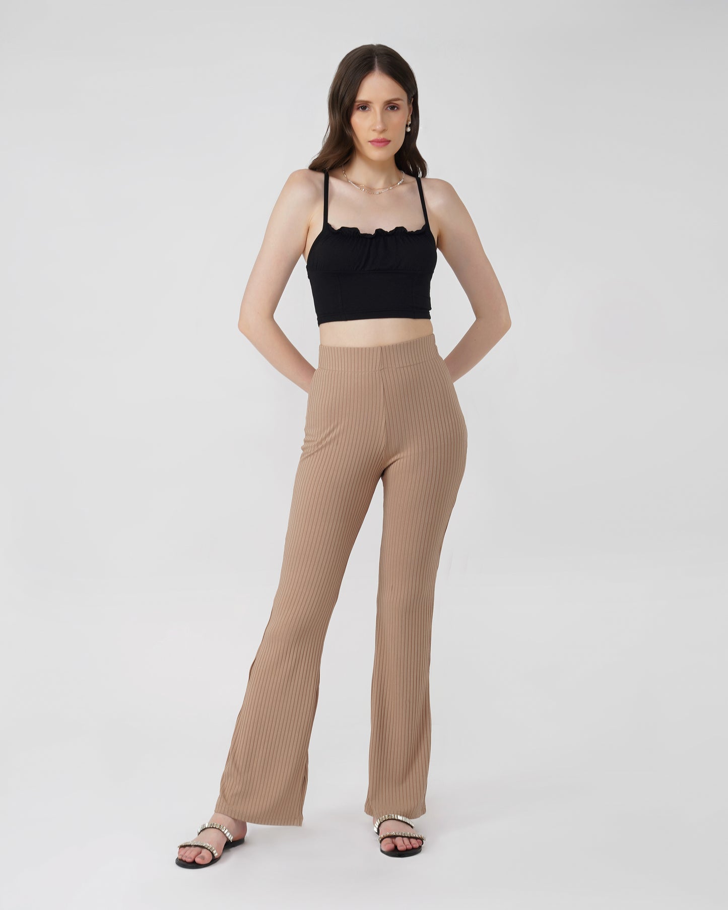 RIBBED FLARED TROUSER,Color: Nude
Fabric: Ribbed
Fit: Flared Fit 
Length: Full Length (43 inches)
Waist: High Rise
Print: Solid
Details: Ribbed Surface,bottomwear,trousers,casual,knitted,ribbed,nude,flared fit,flared,full length,flared,high rise,suited for influencer,ribbed-flared-trouser-nude