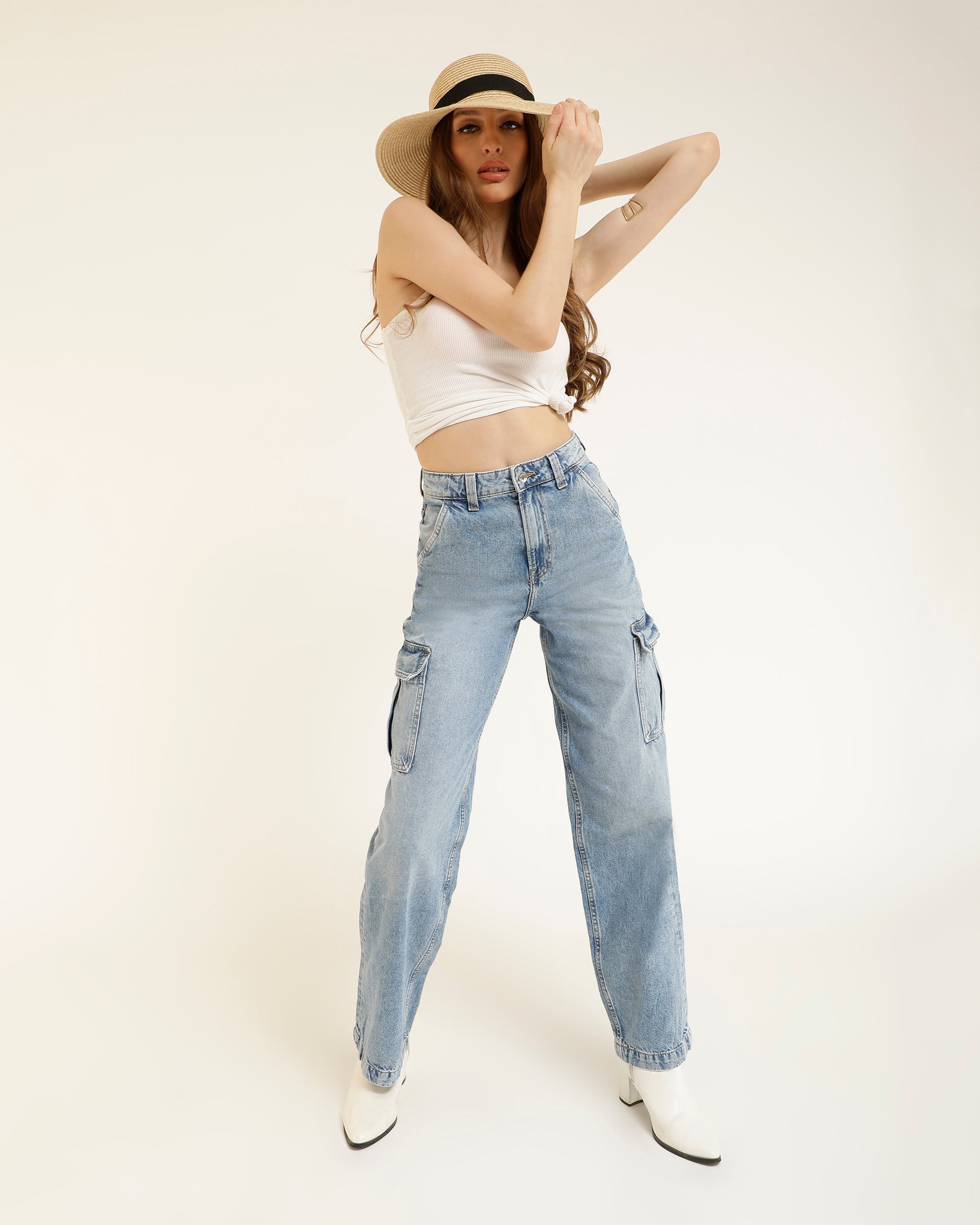 CARGO JEANS,baggy, bottomwear, cargos, denim, full length, high rise, high waist, icy blue, jeans, light blue, straight fit, washed jeans, wide leg, Length - Full length Waist - High-rise waist Fit - Baggy fit Color - Icy blue No. of Pockets - 6 Material - Denim Length - 43" Closure - Zip &amp; button Detail - Washed effect