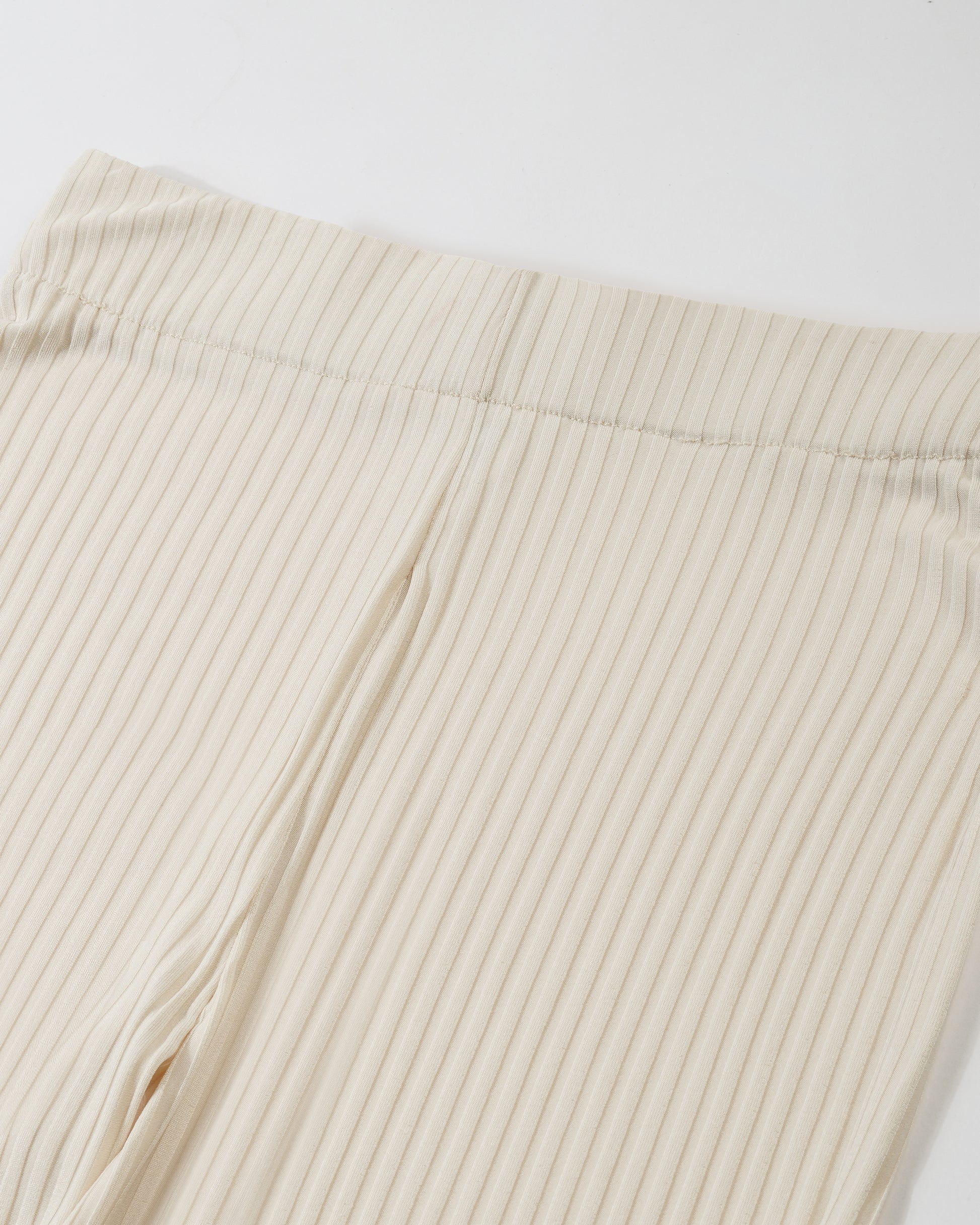 RIBBED FLARED TROUSER,Color: Cream
Fabric: Ribbed 
Fit: Flared Fit 
Length: Full Length (43 inches)
Waist: High Rise
Print: Solid
Details: Ribbed Surface,bottomwear,trousers,casual,knitted,ribbed,cream,flared fit,flared,full length,flared,high rise,suited for influencer,ribbed-flared-trouser-cream