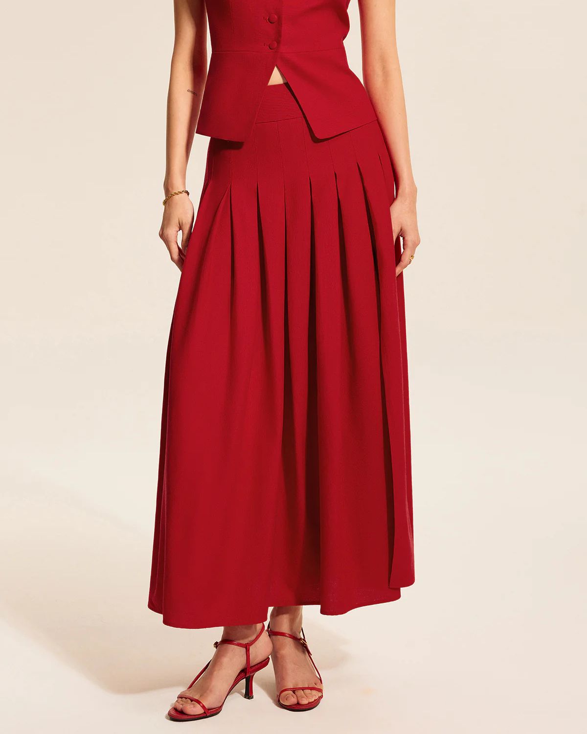 coord sets,bottomwear, topwear,casual, casual chic, outdoor events,bold, genz fit, sophisticated, summer, urban fit,woven,cotton twill,red,solid,panelling, pleated,button, zipper,tailored fit top,vest,waist length top,slit hem,square neck,shoulder strap,no sleeves,sleeveless,button down top,skirts,pleated skirt,midi skirt,slit hem,mid rise waist,no pockets
OY3047,	25070019GG