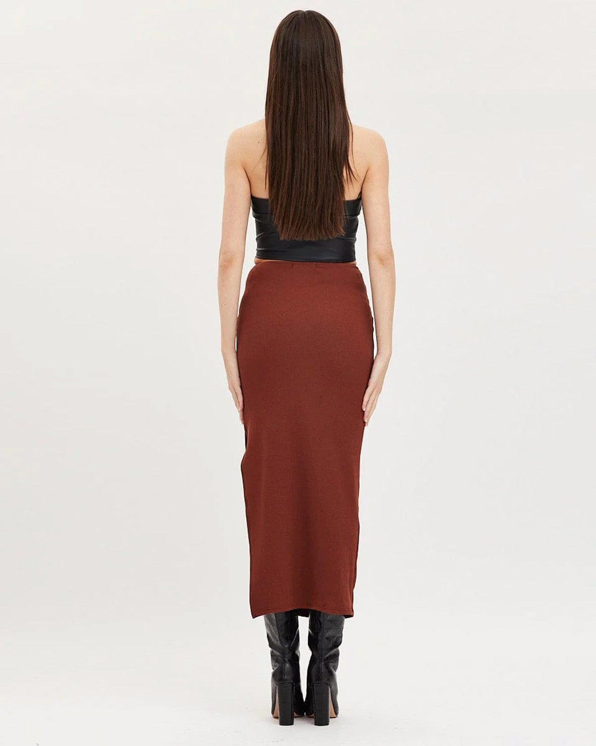 ribbed-slit-ring-detail-slit-skirt-brown-oy1514,25010014GG72,bottomwear,skirts,party,glam, streetwear,knitted,ribbed,brown,skinny fit,slit,midi,mid rise,Color: Brown
Fabric: Ribbed
Fit: Slim Fit
Type: Slit Skirt
Length: Midi
Waist: Mid Rise
Closure: Elasticated
Print: Solid
Detail: Ring in the centre front gives a snatched waist look.,RIBBED SLIT RING DETAIL SLIT SKIRT