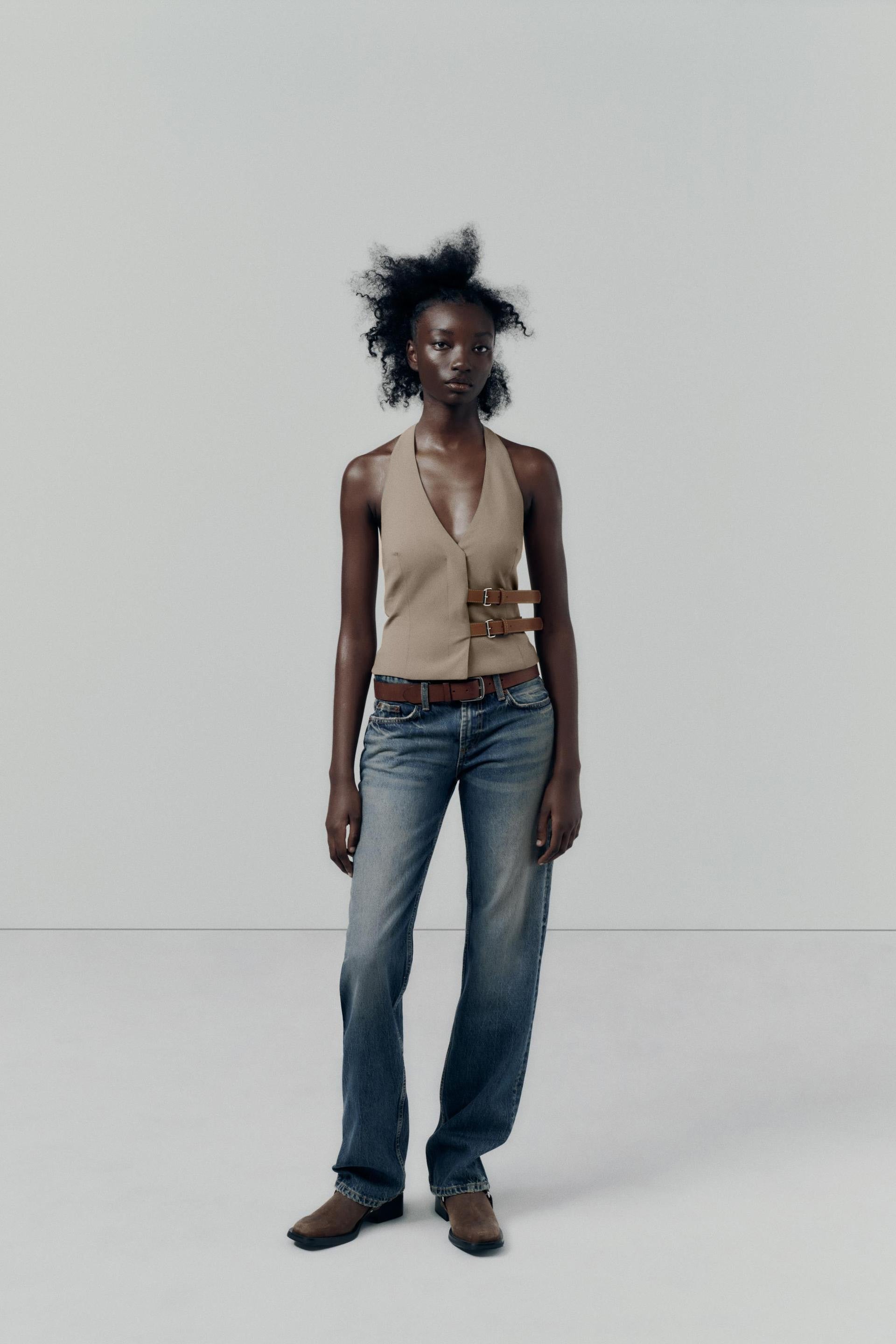 topwear,tops,semi formal, outdoor events,creative workwear, minimal, sophisticated,stretchable,polyester, spandex,beige,solid,contrast,buckle, button, belt,tailored fit,fitted,waist length,v-neck,sleeveless	OY1711,25010066GG