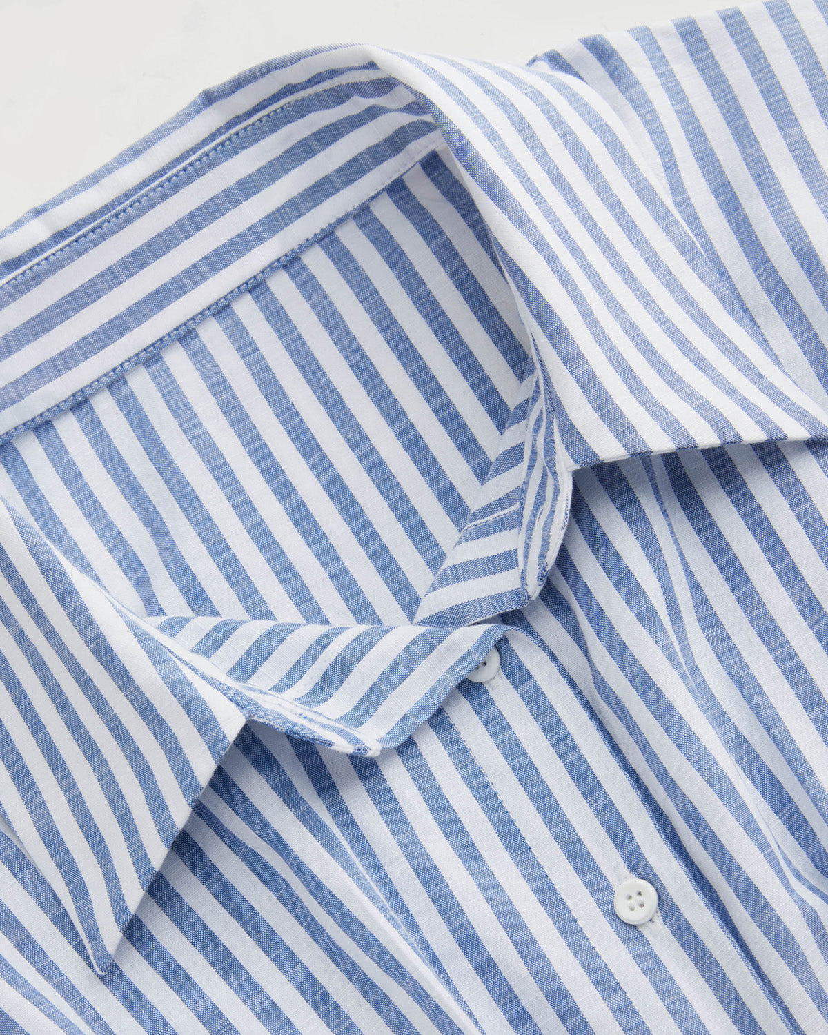 topwear,tops,casual, outdoor events,minimal, summer, streetwear,woven,linen,printed,blue,color block, pinstripes,pleated, pinstripes,button,tailored fit,fit and flare,waist length,curved hem,shirt collar,batwing sleeve,short sleeves	25060048GG,OY2016