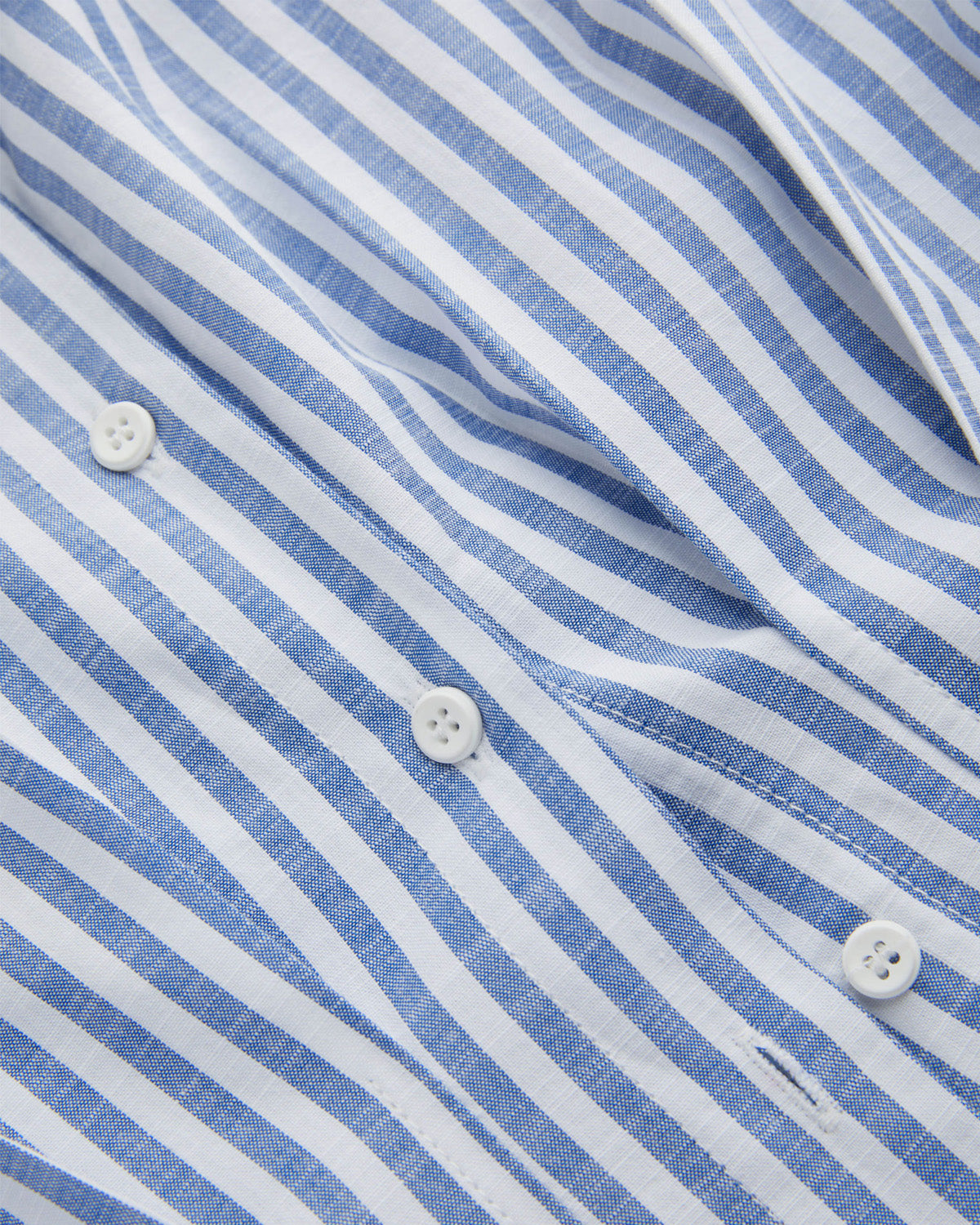 topwear,tops,casual, outdoor events,minimal, summer, streetwear,woven,linen,printed,blue,color block, pinstripes,pleated, pinstripes,button,tailored fit,fit and flare,waist length,curved hem,shirt collar,batwing sleeve,short sleeves	25060048GG,OY2016