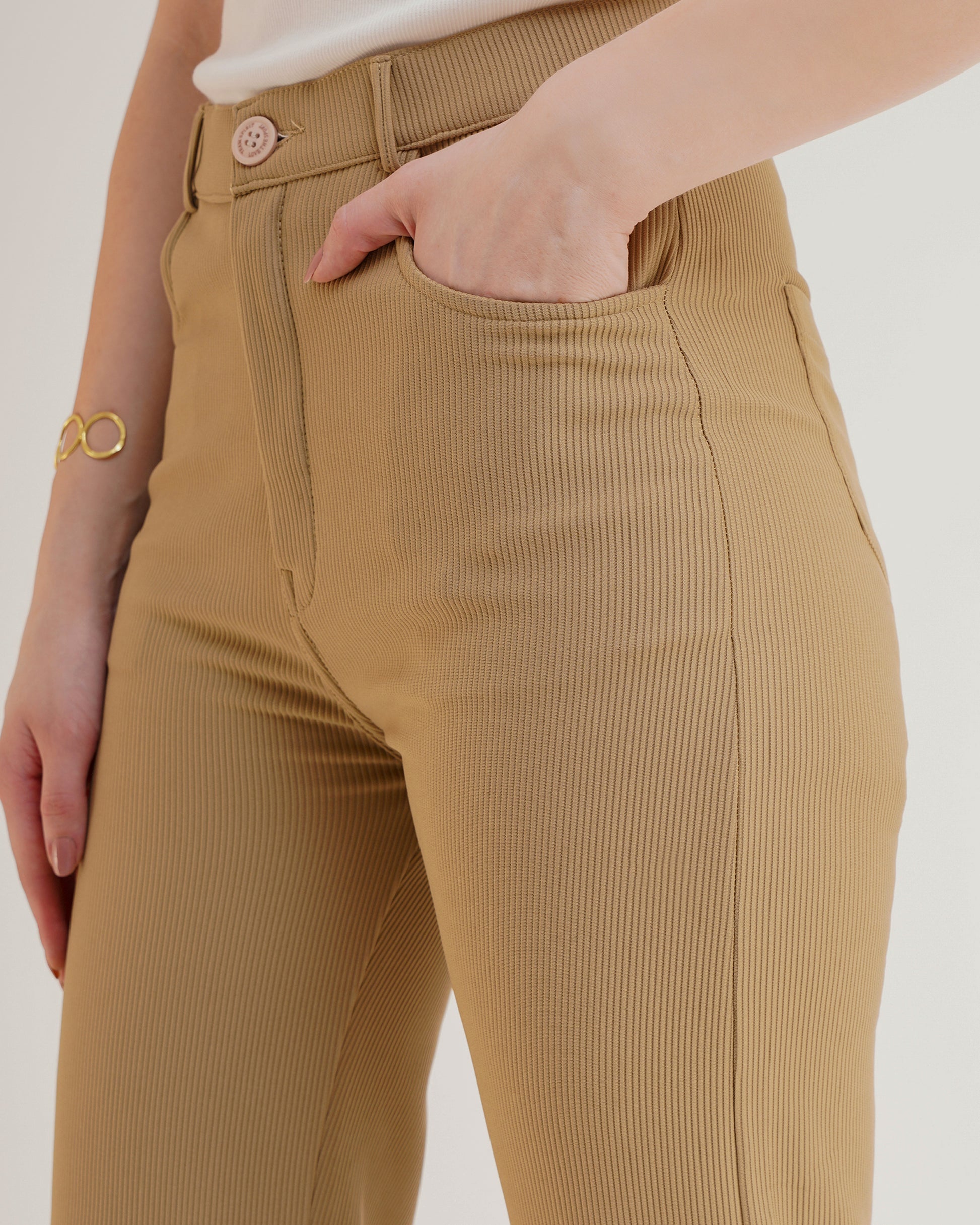 RIBBED TROUSERS,beige, bottomwear, formal, full length, high waist, ribbed, straight fit, trousers,ribbed-trousers-beige,Length - Full Length (41 Inches) Waist - High Waist Fit- Straight Fit Color - Beige No. of Pockets - 4 Closure - Zip &amp; Buttons