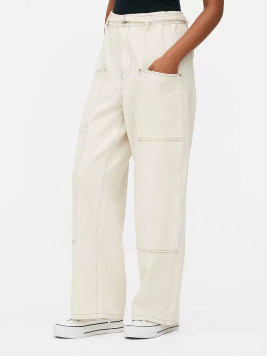 WIDE LEG PATCH POCKET JEANS,bottomwear, casual, cotton, cotton twill, full length, high rise, ivory, jeans, patch pocket, straight fit, streetwear, utility pocket, woven,wide-leg-patch-pocket-ivory-jeans,Length - Full lengthWaist - High-rise waistFit - Wide leg fitColor - IvoryNo. of Pockets - 5Material - CottonLength - 40-42 inchClosure - Zip &amp; buttonDetail - Patch pocket** Belt displayed in the image is not available with the actual product.