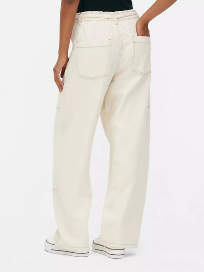 WIDE LEG PATCH POCKET JEANS,bottomwear, casual, cotton, cotton twill, full length, high rise, ivory, jeans, patch pocket, straight fit, streetwear, utility pocket, woven,wide-leg-patch-pocket-ivory-jeans,Length - Full lengthWaist - High-rise waistFit - Wide leg fitColor - IvoryNo. of Pockets - 5Material - CottonLength - 40-42 inchClosure - Zip &amp; buttonDetail - Patch pocket** Belt displayed in the image is not available with the actual product.