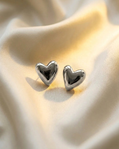 Heart shaped stud earrings in silver finish
