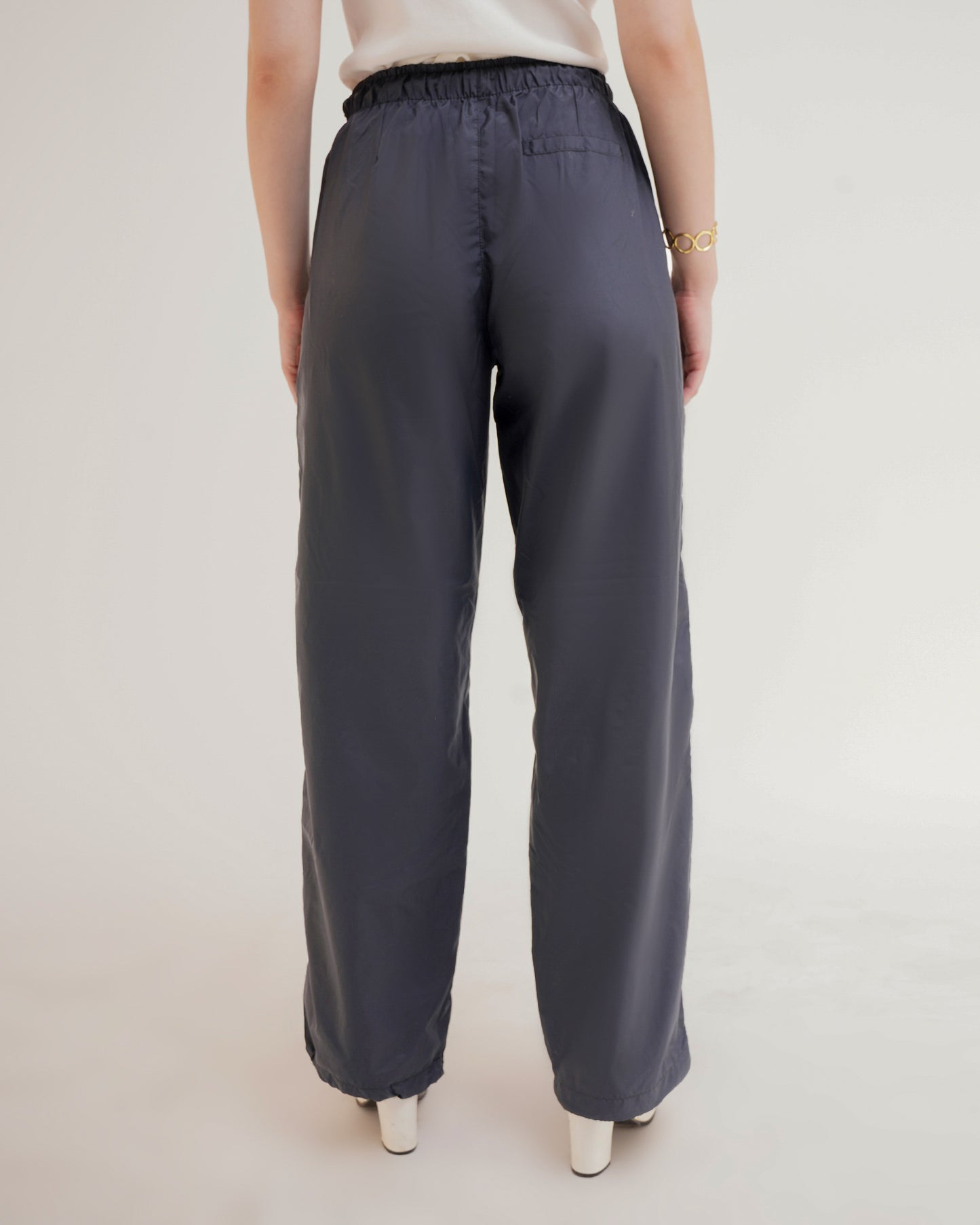 RELAXED FIT PARACHUTE PANTS,bottomwear, cargos, casual, dark blue, drawstring, full length, mid rise, parachutes, polyester, relaxed fit, streetwear, summer, woven,unisex-parachute-pants,Length- Full lengthWaist- High WaistFit- Wide LegColor- Dark Blue No. of Pockets- 2Closure- Zip, Snap Button &amp; Drawstring