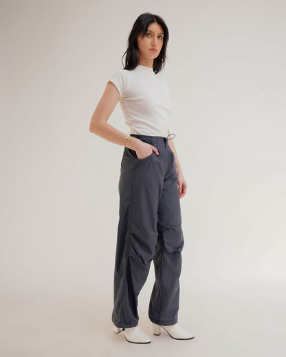 RELAXED FIT PARACHUTE PANTS,bottomwear, cargos, casual, dark blue, drawstring, full length, mid rise, parachutes, polyester, relaxed fit, streetwear, summer, woven,unisex-parachute-pants,Length- Full lengthWaist- High WaistFit- Wide LegColor- Dark Blue No. of Pockets- 2Closure- Zip, Snap Button &amp; Drawstring