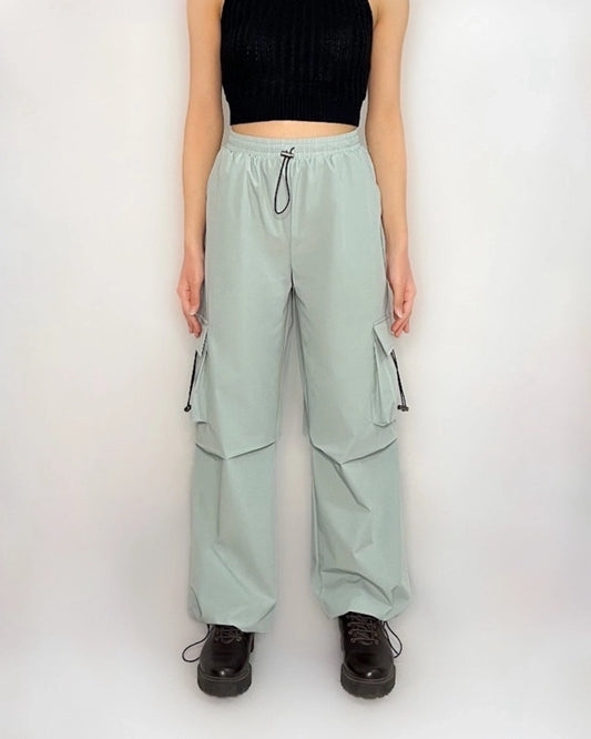 CARGO PARACHUTE PANTS,bottomwear, casual, drawstring, flap pocket, full length, high rise, mint green, parachutes, polyester, straight fit, streetwear, summer, woven,parachute-cargo-trousers-mintgreen,Length - Full Length Waist - High Waist Fit - Wide Leg Fit Color - Mint GreenNo. of Pockets - 4Closure - Drawstrings &amp; Elastic BandSize - Waist(26 - 34 inch)