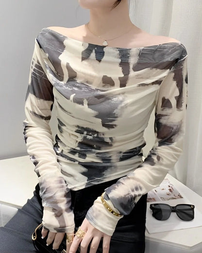 ABSTRACT PRINTED TOP,abstract, casual, fitted, knitted, long sleeves, mesh, multi colored, off shoulder neck, printed, regular, ruched, slim fit, streetwear, stretchable, summer, tops, topwear,abstract-printed-ruched-waist-top-whiteblack,Neck - Boat neckSleeve - Full sleevesFit - Slim fitPrint/Pattern - Abstract printedColor - White and blackMaterial - Lycra meshSize - Bust (32-40) inch