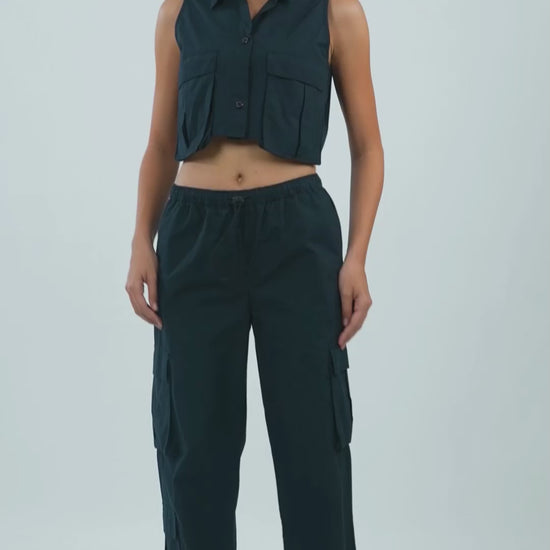 utility-pocket-parachute-pants-black,UTILITY-POCKET PARACHUTE PANTS,Color: BlackFabric: Cotton PoplinFit: Relaxed Fit Length: Full Length (39 in)Waist: Mid RiseClosure: Elasticated with drawstringNo. of Pockets: 5Print: SolidDetail: Flap pockets on sides,coord sets,parachutes,casual,streetwear,woven,cotton, poplin,black,flap pocket, utility pocket,relaxed fit,full length,drawstring,mid rise,Manufacturing batch1_June19